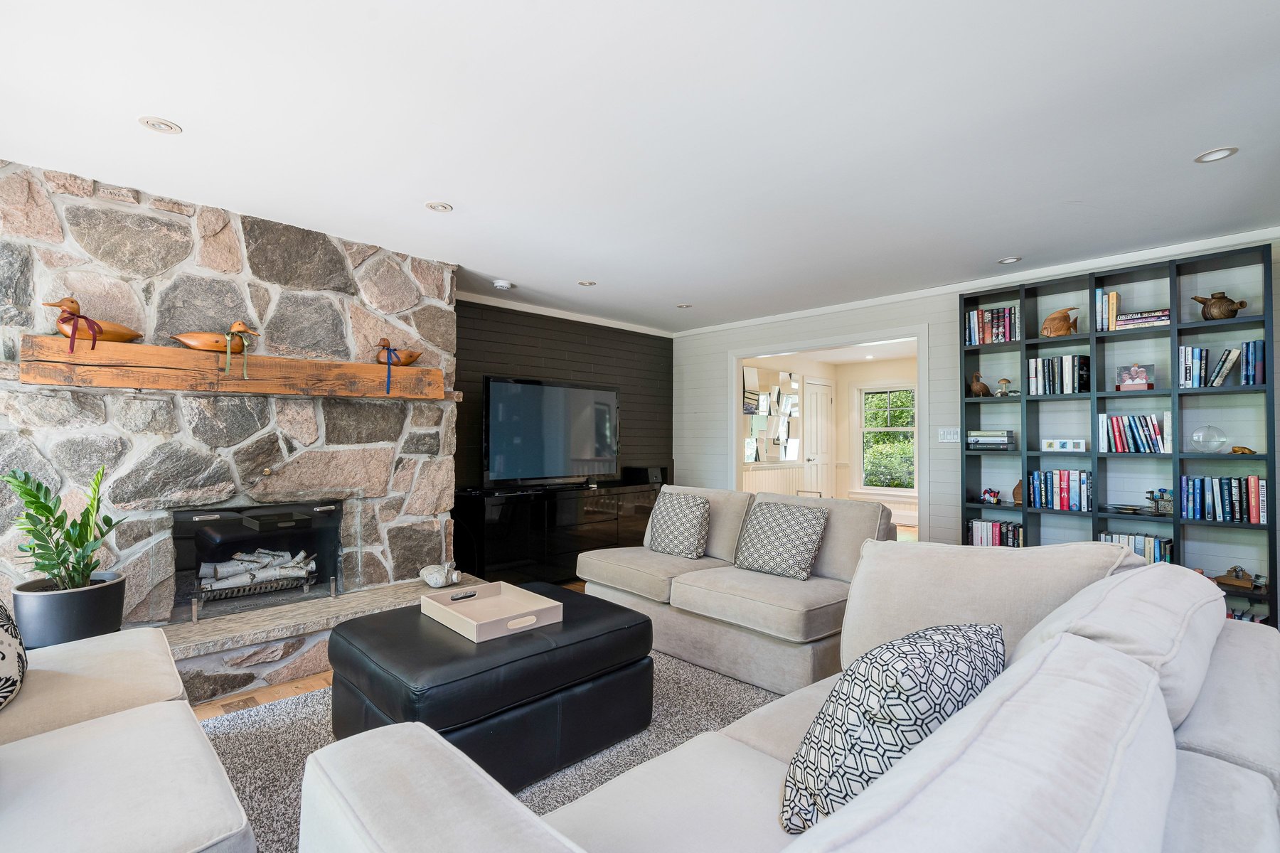 Mulmur bungalow for sale living room with stone fireplace